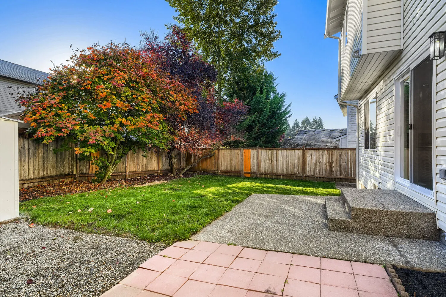 Fenced back yard with patio