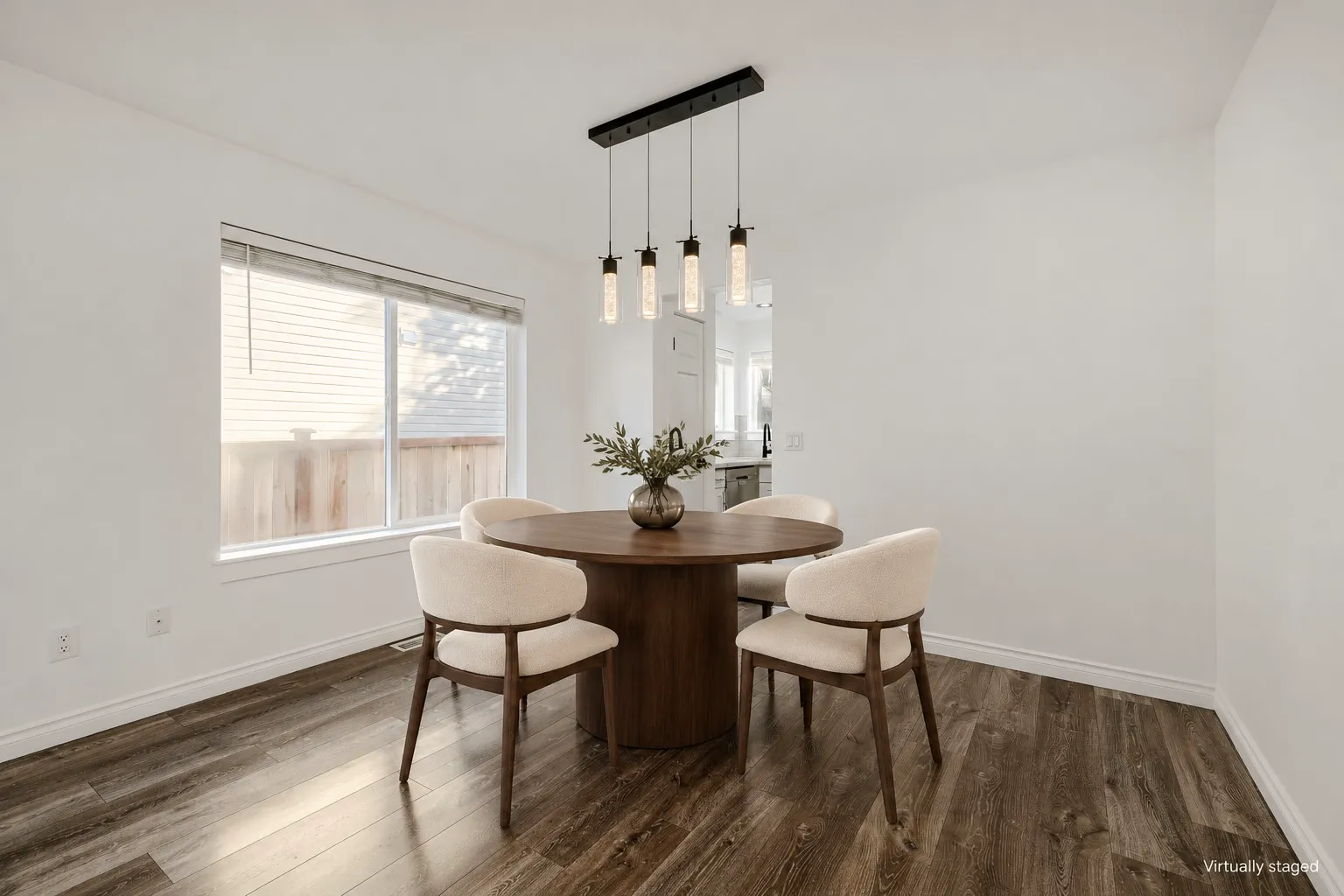 Formal dining room with pendant light, virtually staged