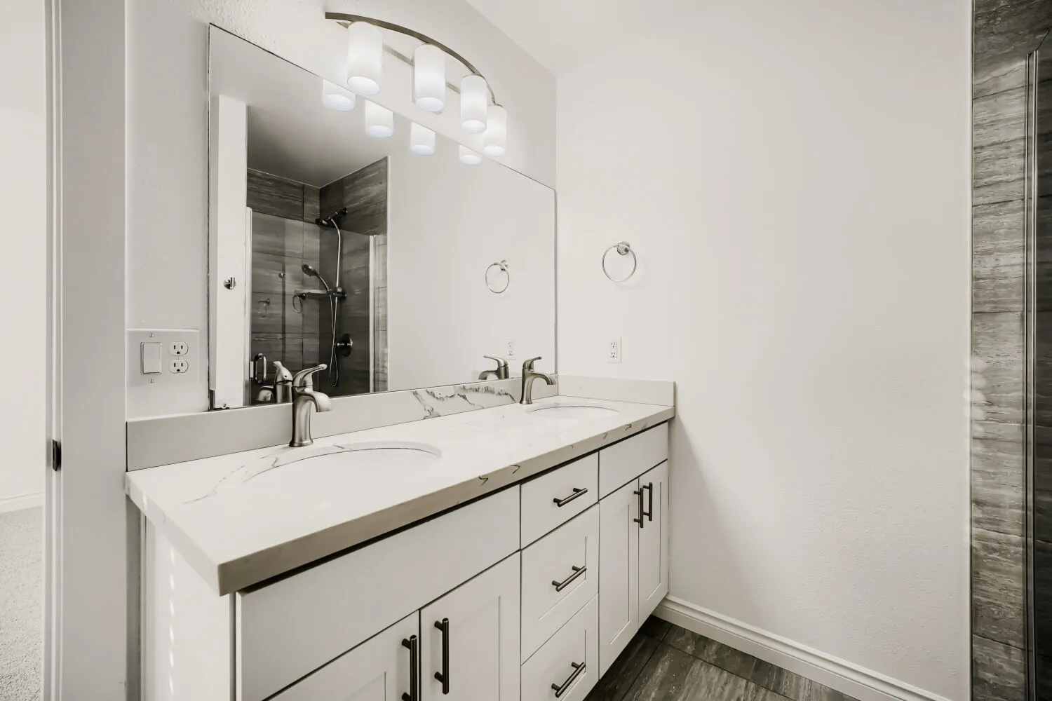 Primary ensuite bathroom with vanity and shower