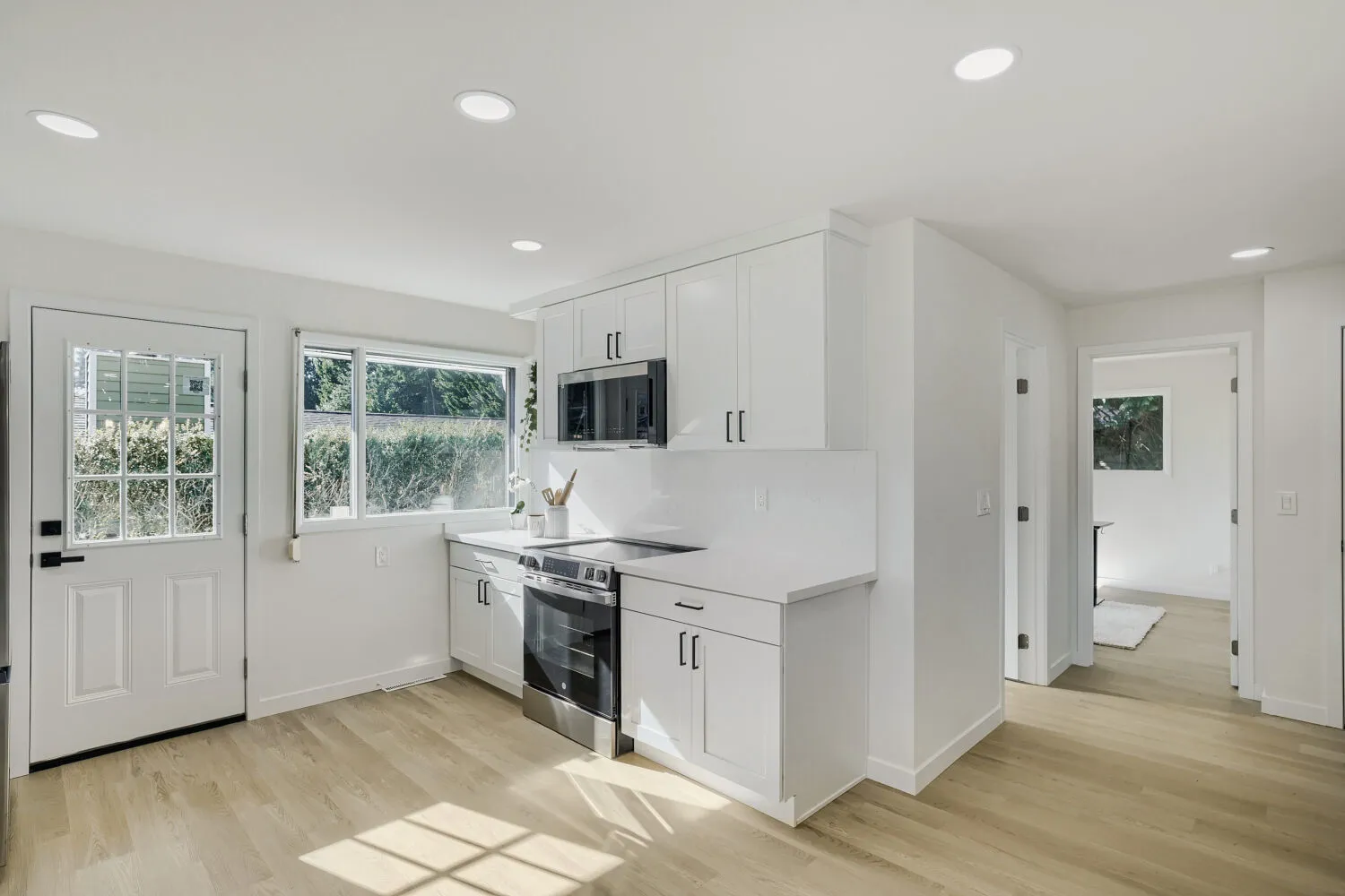 Kitchen with stainless range and pantry