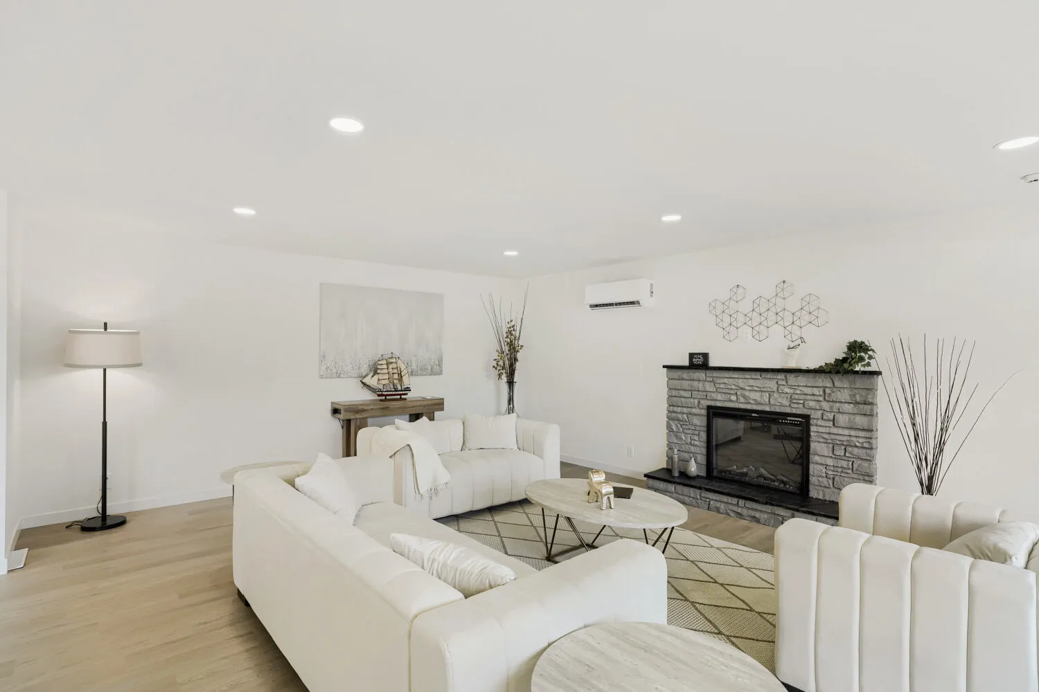 Living room with stone fireplace